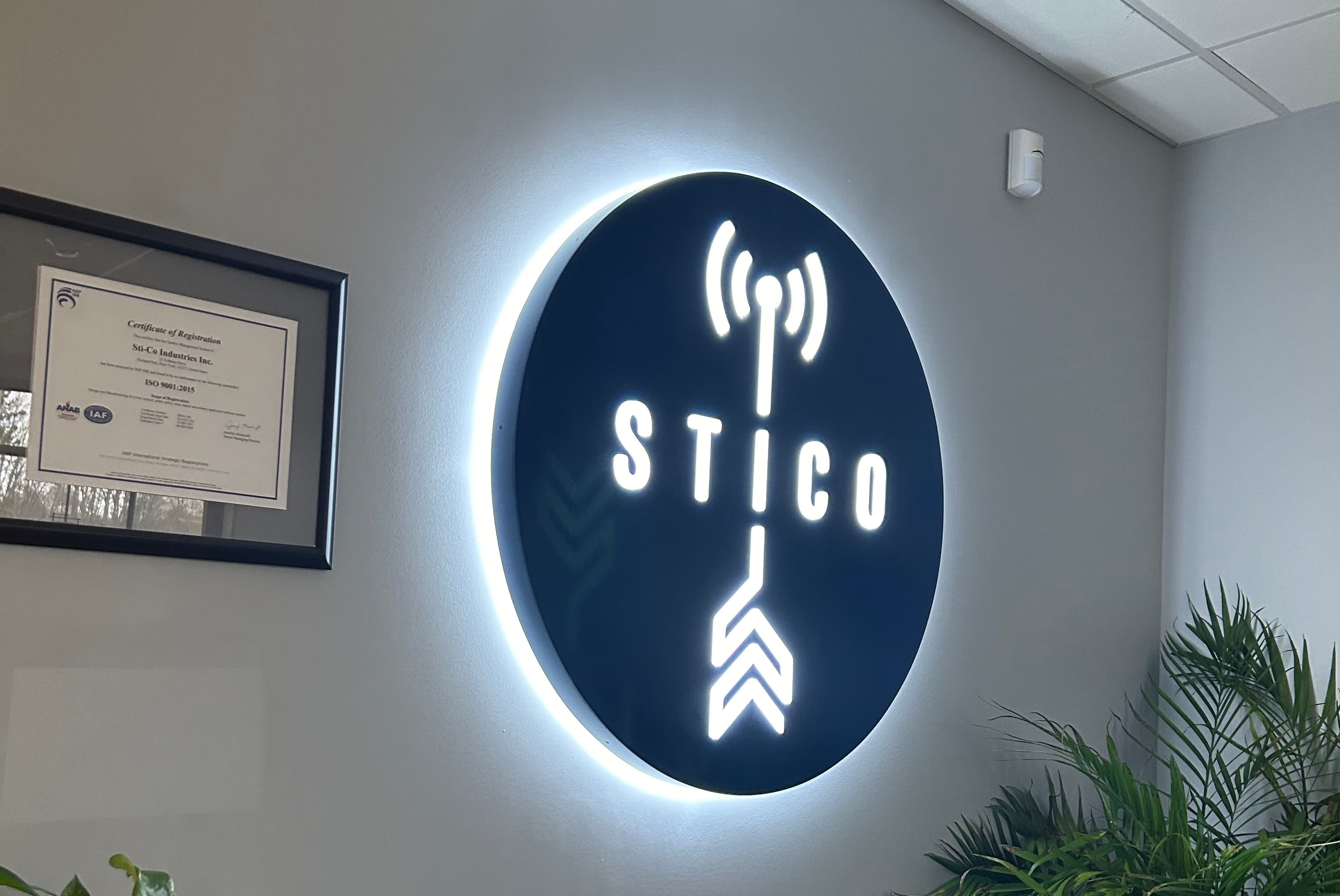 STI-CO sign displayed in the company lobby